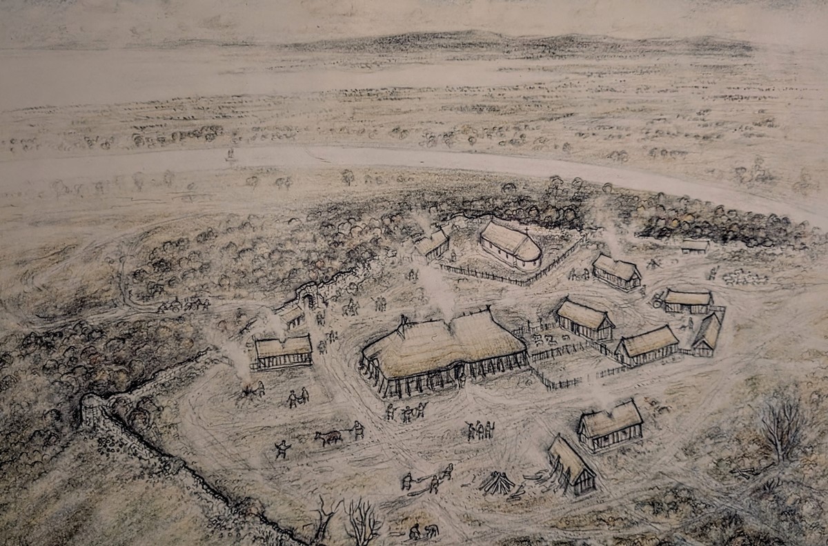 Sketch of some rustic thatched buildings surrounded by a crumbling stone wall.